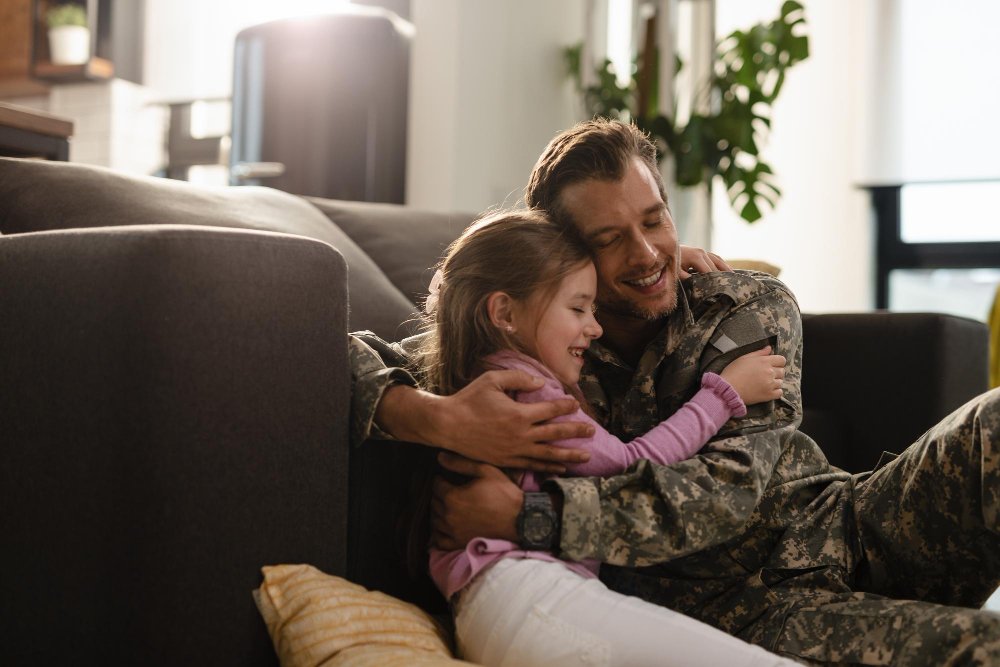 affectionate-military-father-his-daughter-embracing-with-eyes-closed-home-1